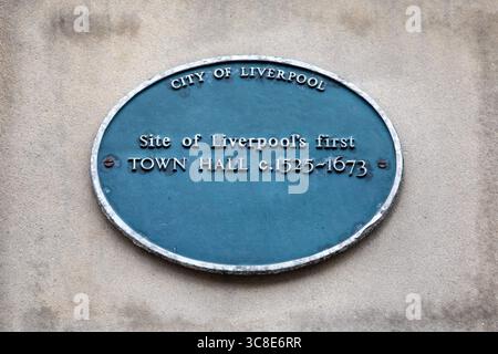 A plaque on the exterior of a building on Dale Street in the city of Liverpool, UK, marking the location of the first town hall in the city which stoo Stock Photo