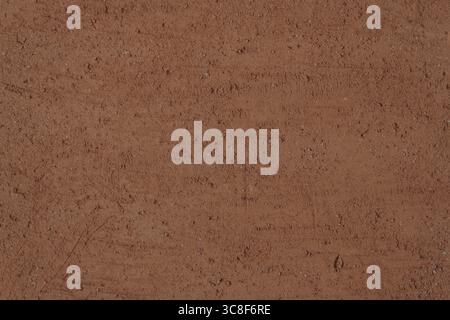 Terracotta texture. Rough with scratches surface of unglazed fired clay, background, close-up, high resolution. Stock Photo