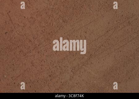 Terracotta texture surface. Rough with scratches surface of unglazed fired clay, background, close-up, high resolution. Stock Photo