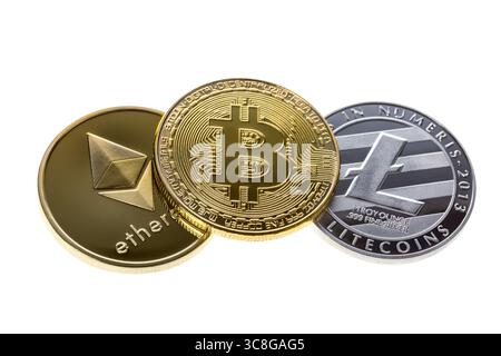 Bitcoin, ethereum and litecoin coins isolated on white background. Close up with selective focus. Stock Photo