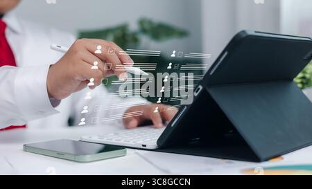 Digital HR management, staff workflow, and paperless human resources system. Customer profile selection and employee checklist interface on digital ta Stock Photo