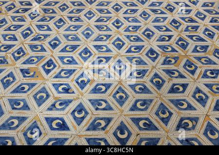 Ceramic floor tiles with crescent moon patterns, typical of Renaissance Italy, in the Piccolomini Library, Siena Cathedral, Siena, Italy. Stock Photo