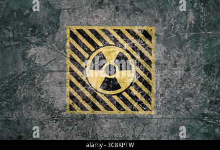Radioactive sign on grey textured surface. Radiological pollution Stock Photo