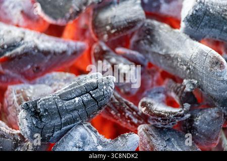 burning red coals in charcoal grill, selective focus Stock Photo