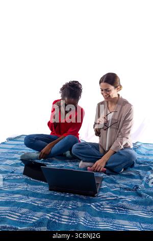 Two women working remotely and sharing a good time Stock Photo