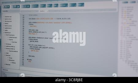 Close up of code being typed on PC screen by admin developing software, entering commands. Computer display used by IT professional at home fixing errors in application, implementing new features Stock Photo
