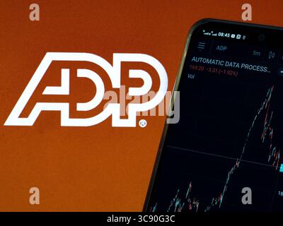 February 22, 2021, Ukraine: In this photo illustration the stock market information of Automatic Data Processing, Inc. seen displayed on a smartphone with a logo of Automatic Data Processing in the background. (Credit Image: © Igor Golovniov/SOPA Images via ZUMA Wire) Stock Photo