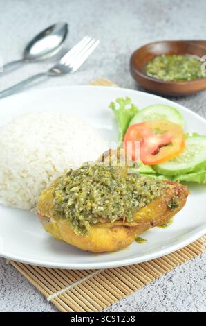Green chili smashed fried chicken is a common and popular dish in Indonesia. Stock Photo