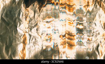 Wrinkled foil texture. Glitch effect surface. Glossy metal white glare scratched gray abstract background. Colorful distressed old reflection. Stock Photo