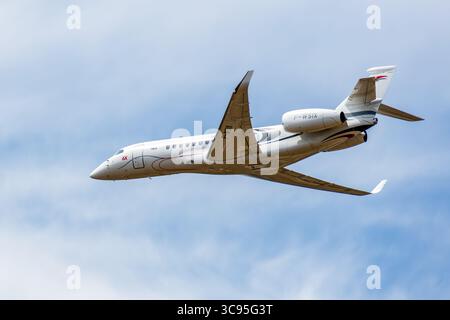 A Falcon 6X, a large, long-range business jet developed by french manufacturer Dassault Aviation, in low altitude flight over Paris-Le Bourget airport Stock Photo
