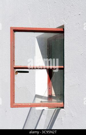 Open Window with Broken Glass Pane Stock Photo