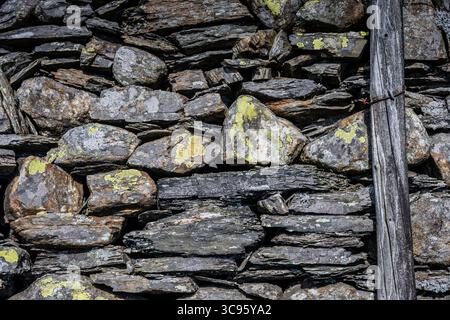 Lakeland slate drystone wall at Coniston, English Lake District. Providing a home for lichen, cyanobacteria. Stock Photo
