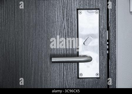 closeup hotel door keyless locking system for privacy safety room double lock with touch key card to unlock Stock Photo