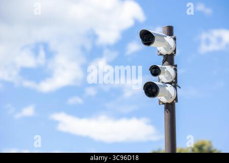 outdoor CCTV, Group of security cameras in public area. Surveillance multiple angle Camera on Pole Stock Photo