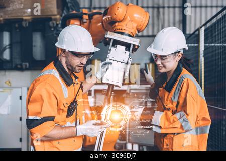 Engineer workers team with modern robotic technology digital innovation device in hand tablet computer concept Stock Photo