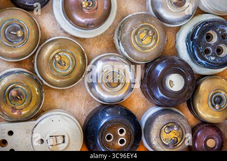 Collection of rusty and weathered vintage light switches Stock Photo