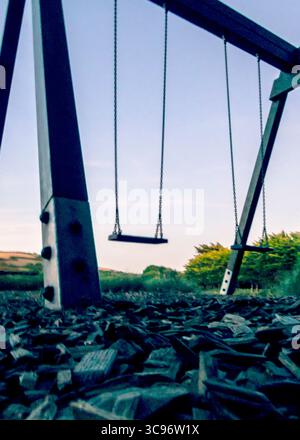 An empty swing set in a park. Stock Photo