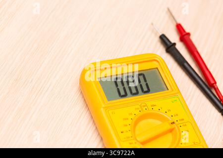 Digital multimeter on a table close up image. Stock Photo