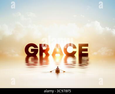 Christian rowing on the sea of grace with bright light, concept of God's grace, background with the word GRACE of grace Stock Photo