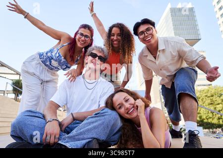 Group of young people smiling and having fun outdoors. Stock Photo