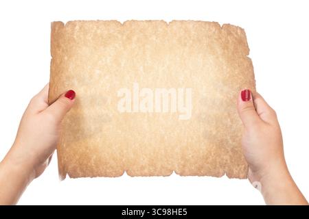 Female hand holding blank old paper scroll isolated on white background. Stock Photo