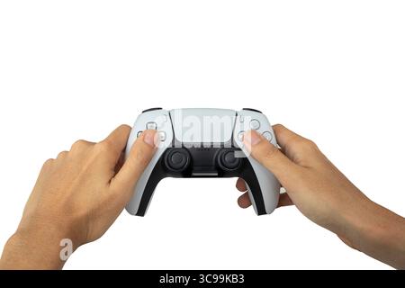 Video game console controller in hand gamer isolated on white background. Playful enjoyment concept. (With clipping path) Stock Photo