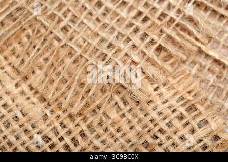 Close-up of textured burlap fabric highlighting natural fibers and craftsmanship. Stock Photo