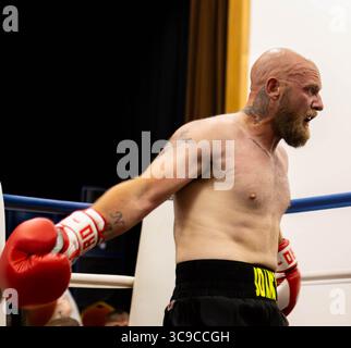 Male boxer in the ring during a fight Stock Photo