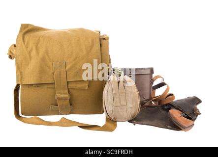 War concept. Militaly flask, first aid kit and handgun on holster isolated on white background. Stock Photo