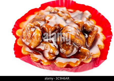 Walnut cake with caramel and honey. Close up on white background. Stock Photo