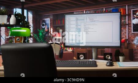 Lines of code written on PC workstation screen on development tool application. Debugging software programming language displayed on computer monitor in living room office Stock Photo