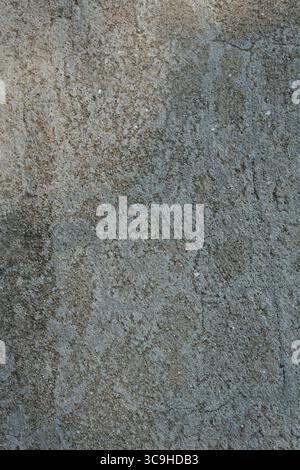 Macro image of a rough-textured concrete wall showing natural granularity and weathered finish. Stock Photo