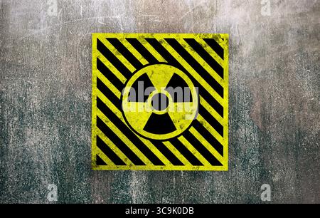 Radioactive sign on grey textured surface. Radiological pollution Stock Photo