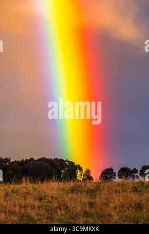 Rainbow over the countryside at Blayney in the Central West of NSW, Australia. Stock Photo