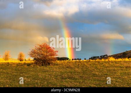 Rainbow over the countryside at Blayney in the Central West of NSW, Australia. Stock Photo