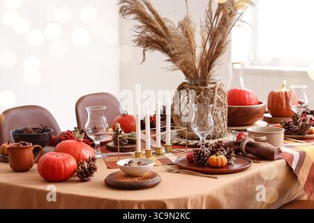 Autumn table setting with pumpkins and cones Stock Photo