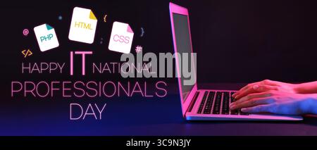 Programmer working with modern laptop on black background. National IT Professionals Day Stock Photo