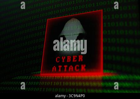 February 27, 2023, Asuncion, Paraguay: Visual representation of hacker and the words ''cyber attack'' backdropped by binary code digits displayed on a screen. (Credit Image: © Andre M. Chang/ZUMA Press Wire) Stock Photo