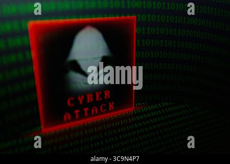 February 27, 2023, Asuncion, Paraguay: Visual representation of hacker and the words ''cyber attack'' backdropped by binary code digits displayed on a screen. (Credit Image: © Andre M. Chang/ZUMA Press Wire) Stock Photo