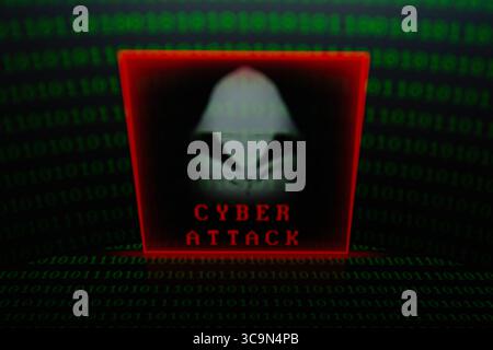 February 27, 2023, Asuncion, Paraguay: Visual representation of hacker and the words ''cyber attack'' backdropped by binary code digits displayed on a screen. (Credit Image: © Andre M. Chang/ZUMA Press Wire) Stock Photo