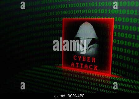February 27, 2023, Asuncion, Paraguay: Visual representation of hacker and the words ''cyber attack'' backdropped by binary code digits displayed on a screen. (Credit Image: © Andre M. Chang/ZUMA Press Wire) Stock Photo