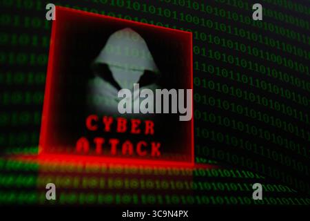 February 27, 2023, Asuncion, Paraguay: Visual representation of hacker and the words ''cyber attack'' backdropped by binary code digits displayed on a screen. (Credit Image: © Andre M. Chang/ZUMA Press Wire) Stock Photo