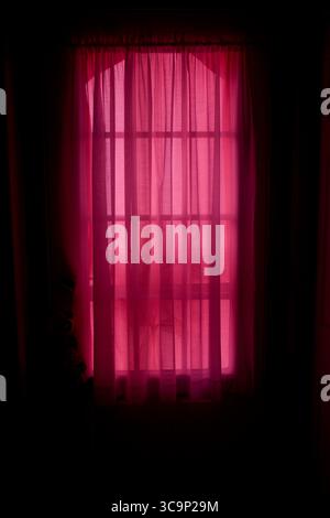 Pennsylvania, USA: Daylight Streaming through Sheer Red Window Curtains (Credit Image: © Novo Images/Glasshouse via ZUMA Press Wire) Stock Photo