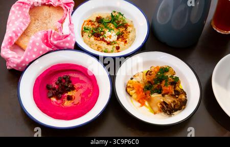 Different types of meze dishes served on table Stock Photo