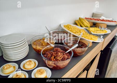 A Colorful Array of Delicious Desserts Showcasing Various Fruits, Sauces, and Sweet Treats on a Buffet Table Spread Stock Photo