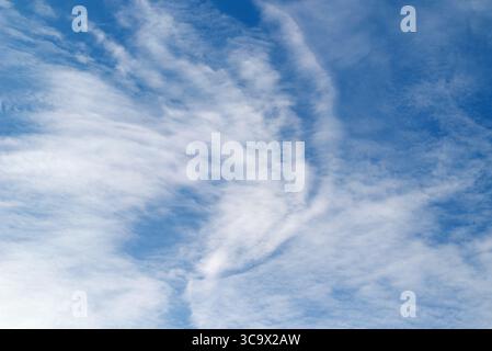 Cirrus, feathery clouds in the blue sky Stock Photo