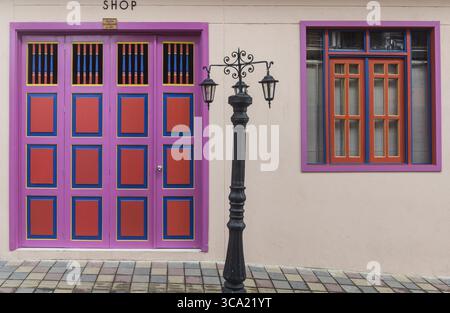 Cheerfully painted door and window in a street in Guatapé, Antioquia Department, Colombia Stock Photo