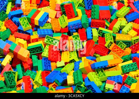 Plastic toy blocks erector set for children as a background. Selective focus. Stock Photo