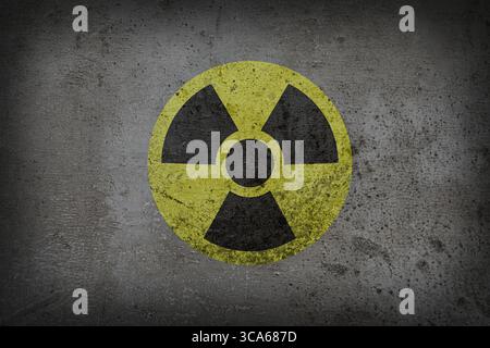Radioactive sign on grey textured surface. Radiological pollution Stock Photo