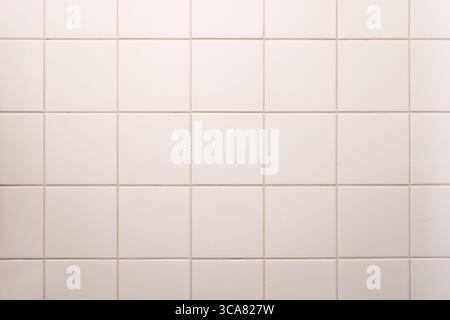 white tiled wall in the bathroom Stock Photo